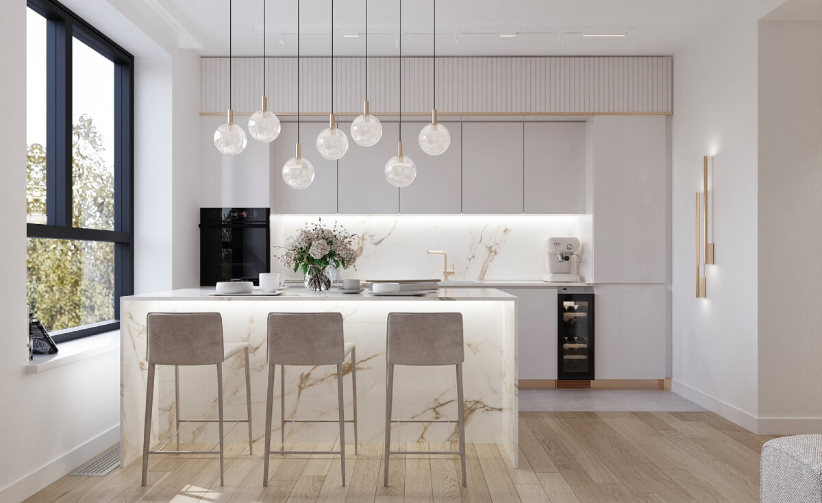 Minimalist kitchen with marble kitchen island, bar stools and glass pendant lighting above the island.