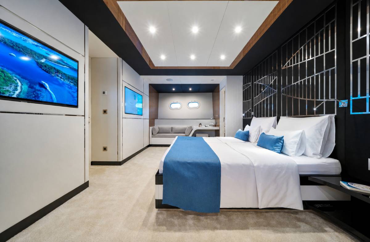 The master cabin of the yacht with bright paneling and lighting