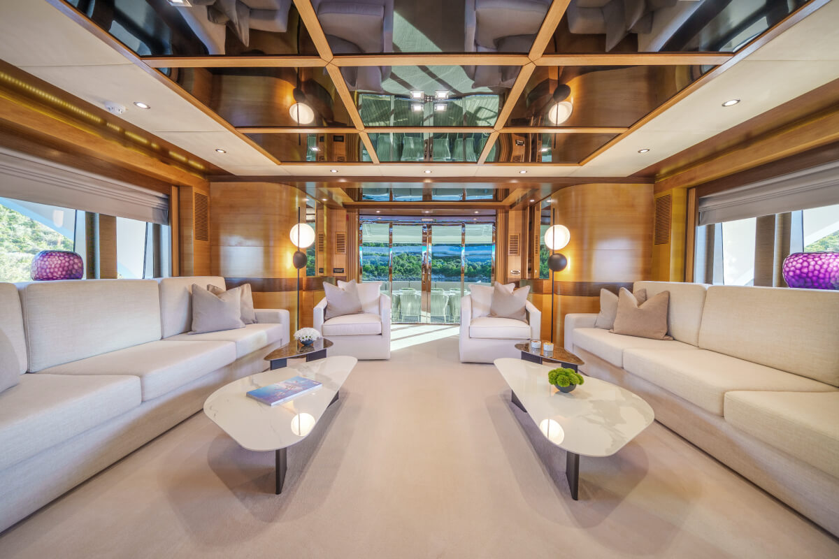The master salon of the Silent World yacht with custom-made sofas and tables