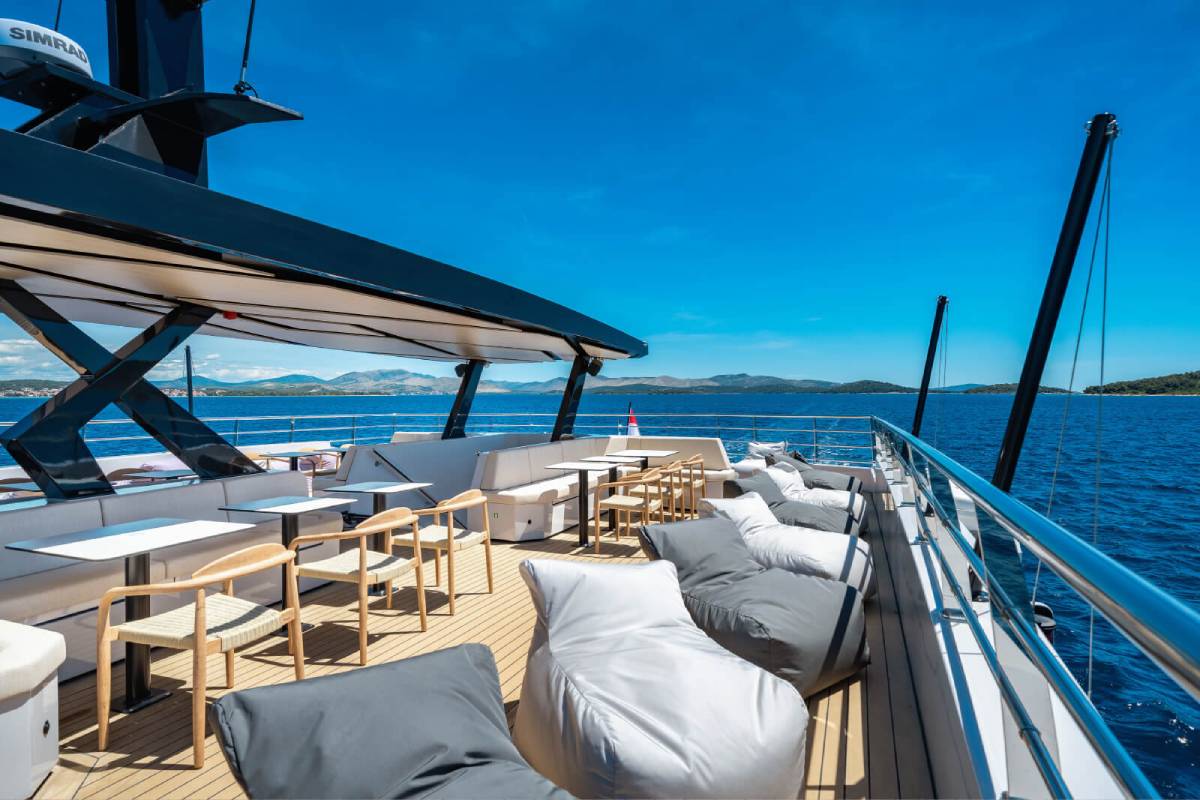 Spacious catamaran deck with sun loungers and sea views